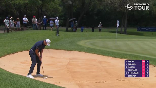 DP World Tour winner putts golf ball out of bunker DP World Tour winner putts golf ball out of bunker