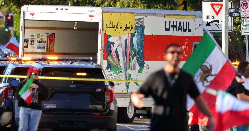 Man booked on reckless driving charge after U-Haul truck drives through Iran protesters in L.A. Man booked on reckless driving charge after U-Haul truck drives through Iran protesters in L.A.