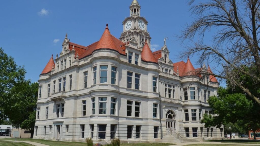 Three-story courthouse with corner gables.