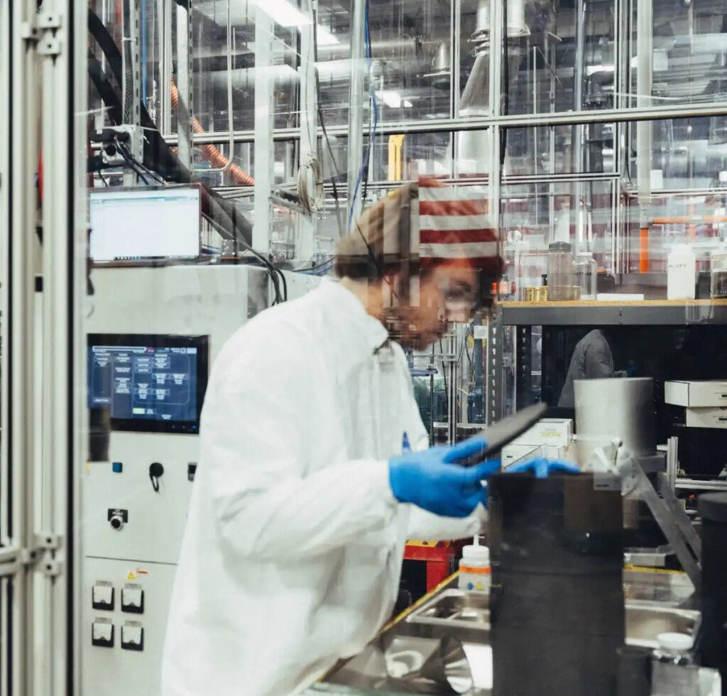 A man works on nuclear fuel in a lab.